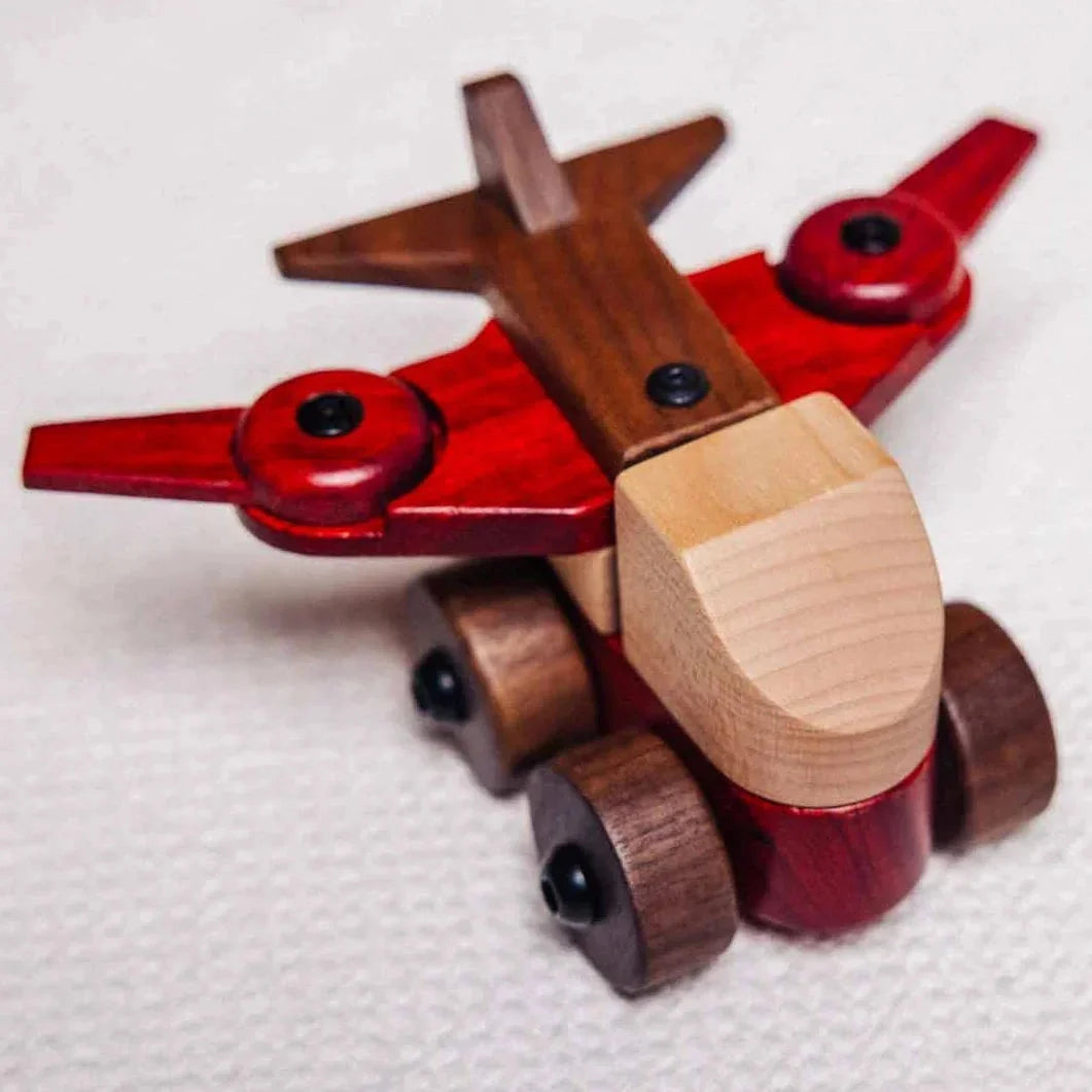 Complete Wooden Vehicles Set aeroplane, front-quarter view, maple fuselage, padauk wings, walnut tail fins and wheel hubs