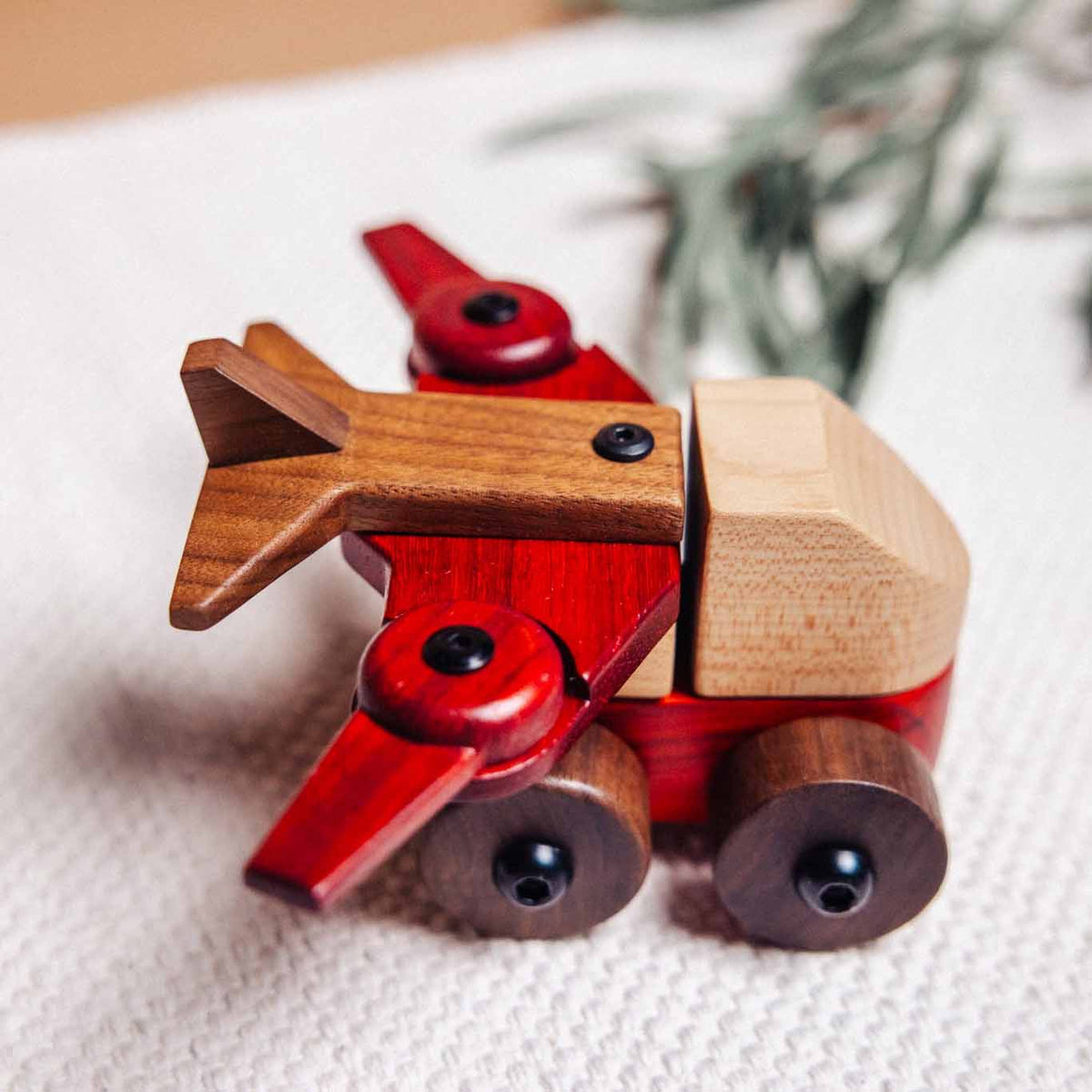 Complete Wooden Vehicles Set aeroplane close-up, padauk body and walnut wings with a maple cab and walnut wheels