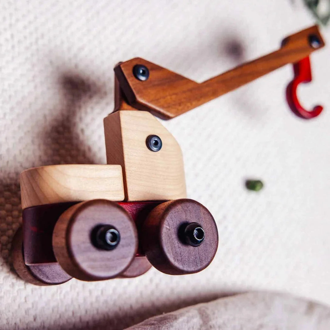 Complete Wooden Vehicles Set crane truck close-up, maple cab and walnut jib with a padauk hook on cream knit