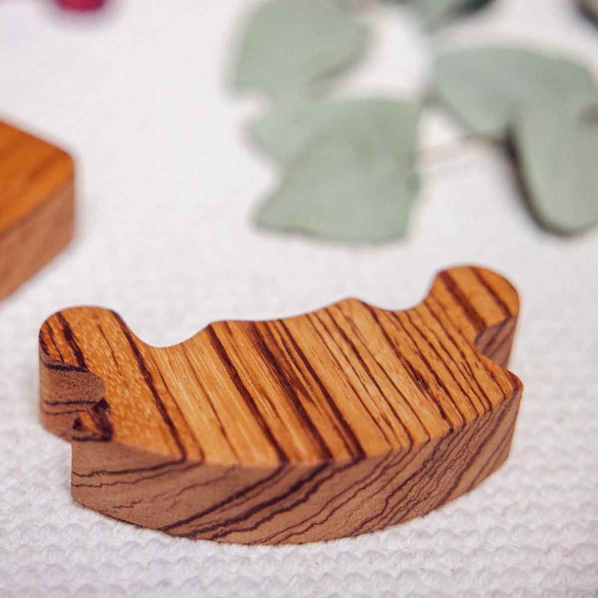 Wooden number puzzle on a textured surface with natural elements