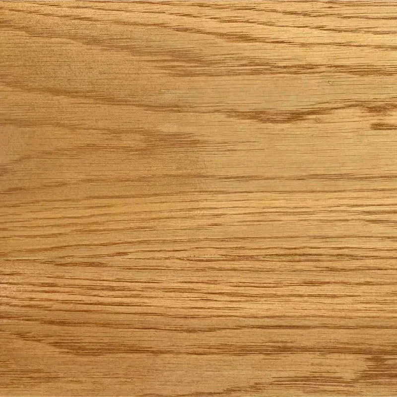 Close-up of warm honey-gold oak wood grain, representing the material behind Oak & Sprout's Action Oak donation.