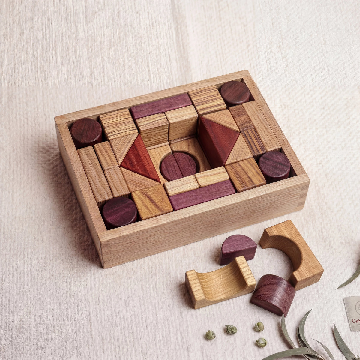Exotic Hardwood Building Blocks 60pc Oak Box Set displayed in oak tray with oak, purpleheart, padauk and zebrano pieces